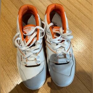 New Balance 550s in white and orange